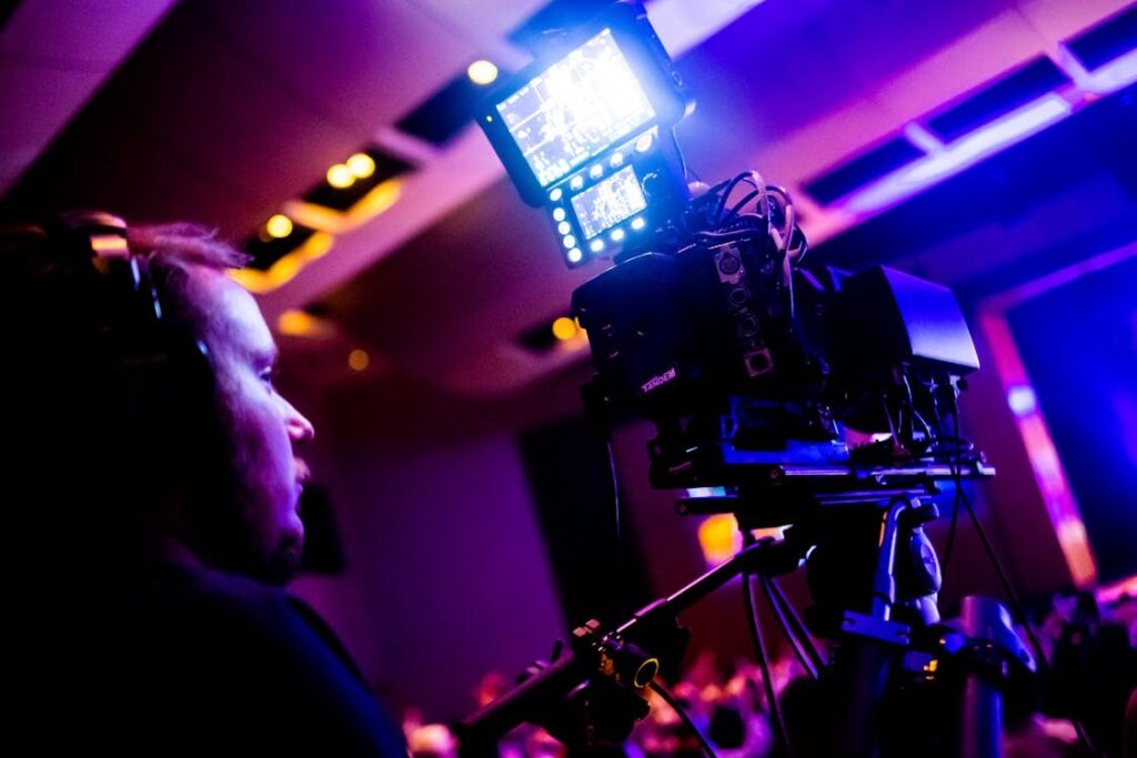 a cameraman filming an event at a club