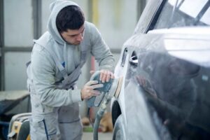 an expert repairing car panels