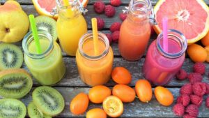 A platter of detox drinks, including fruit juices.